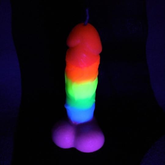 Blacklight reflective cock candle for kinky wax play. Available at The Dungeon Store booth at Exxxotica this weekend