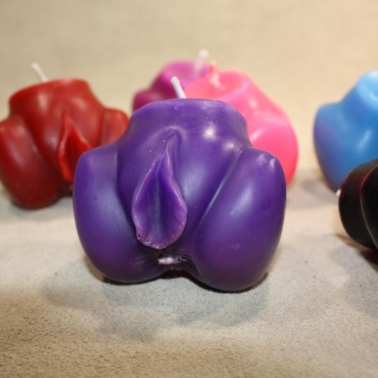 Cunt candles for kinky wax play, including blacklight reflective candles coming to The Dungeon Store Booth at Exxxotica this weekend.