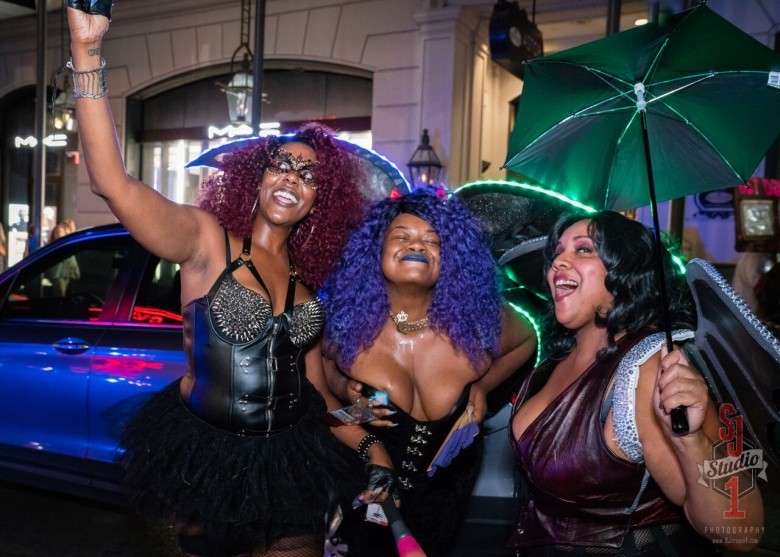 A guest with Mia Darque and Madyson DeLaRough at the traditional Second Line Parade. Dark and DeLaRough will be Mistresses of Ceremonies this year